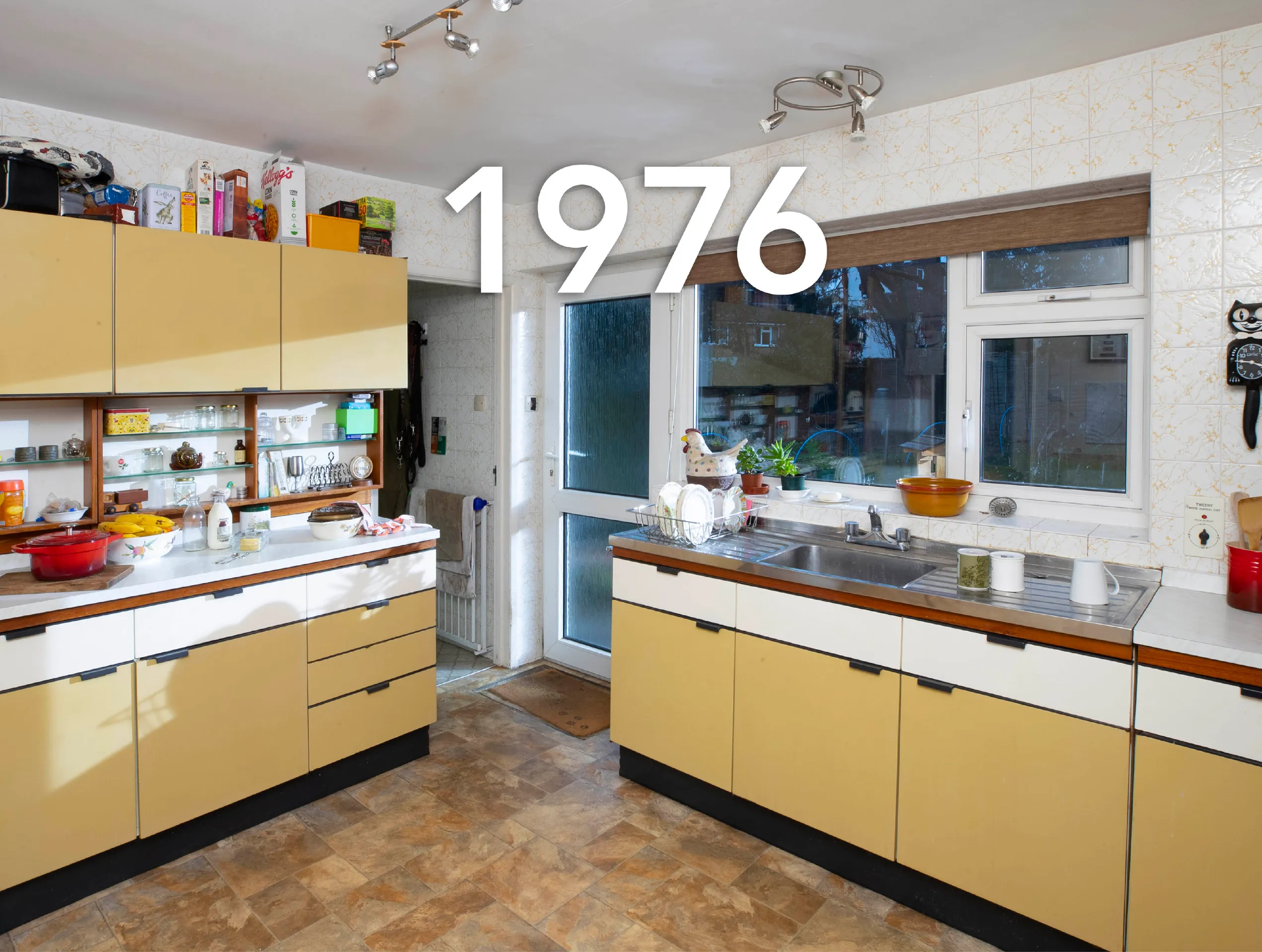 Photo of a 1970s kitchen with a large caption reading '1976'.