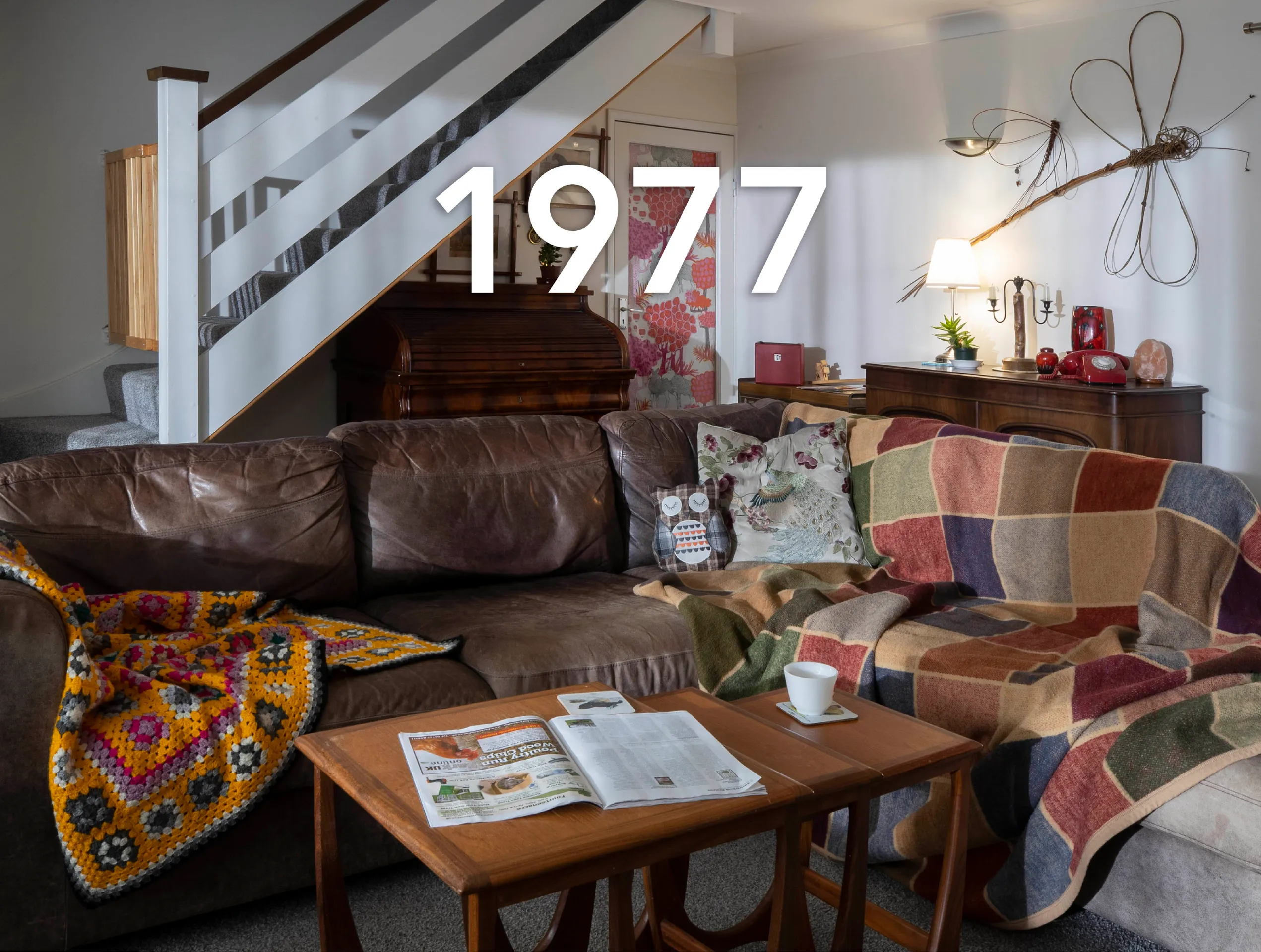 Photo of a 1970s living room with a large caption reading '1977'.