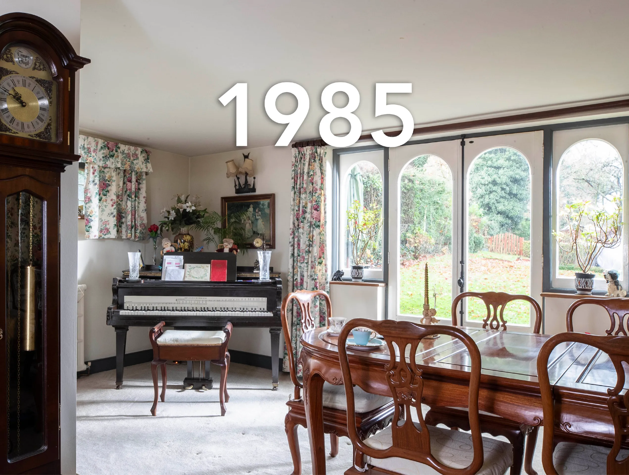 Photo of a 1980s dining room with a large caption reading '1985'.