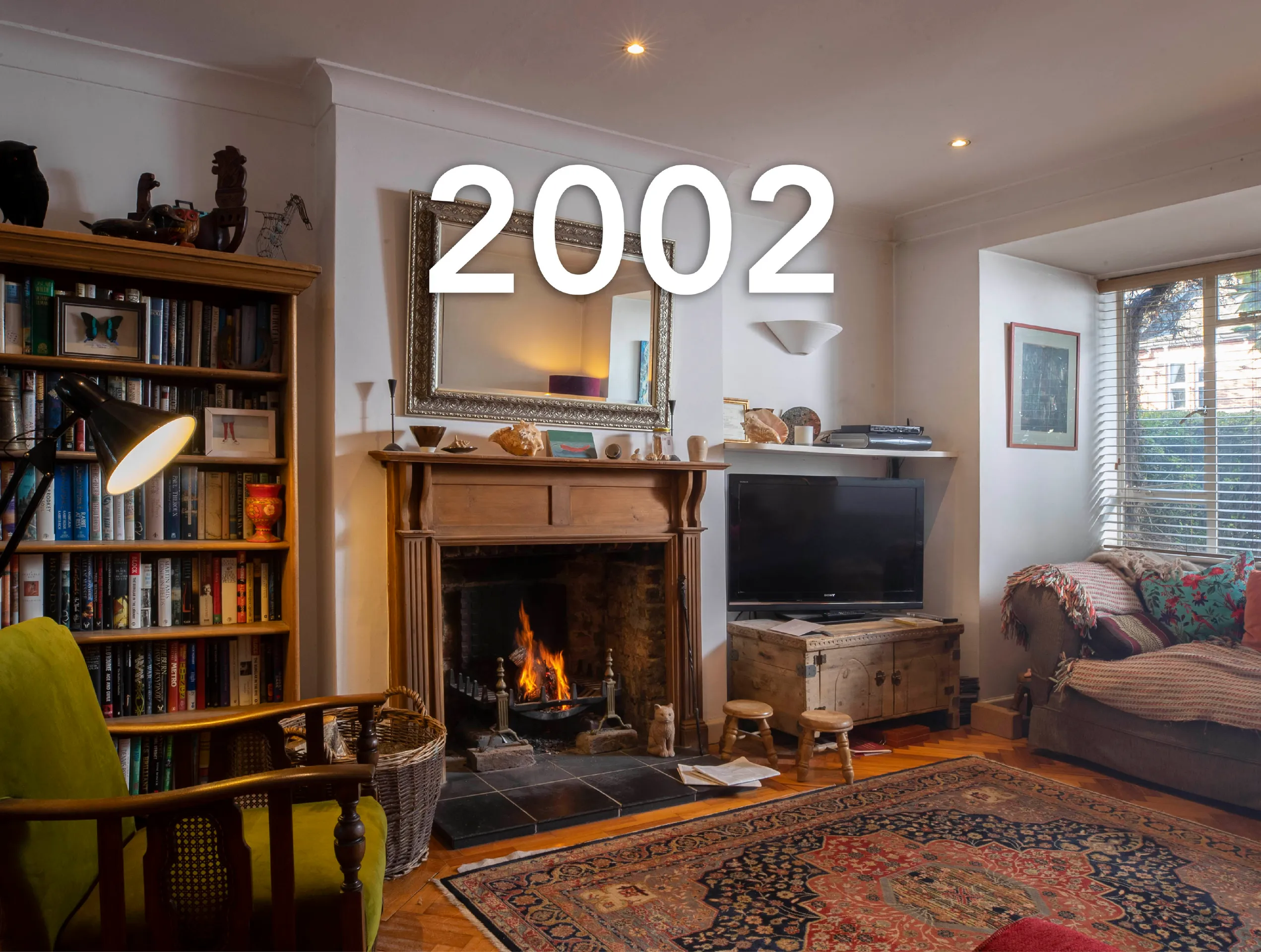 Photo of a 2000s living room with a large caption reading '2002'.