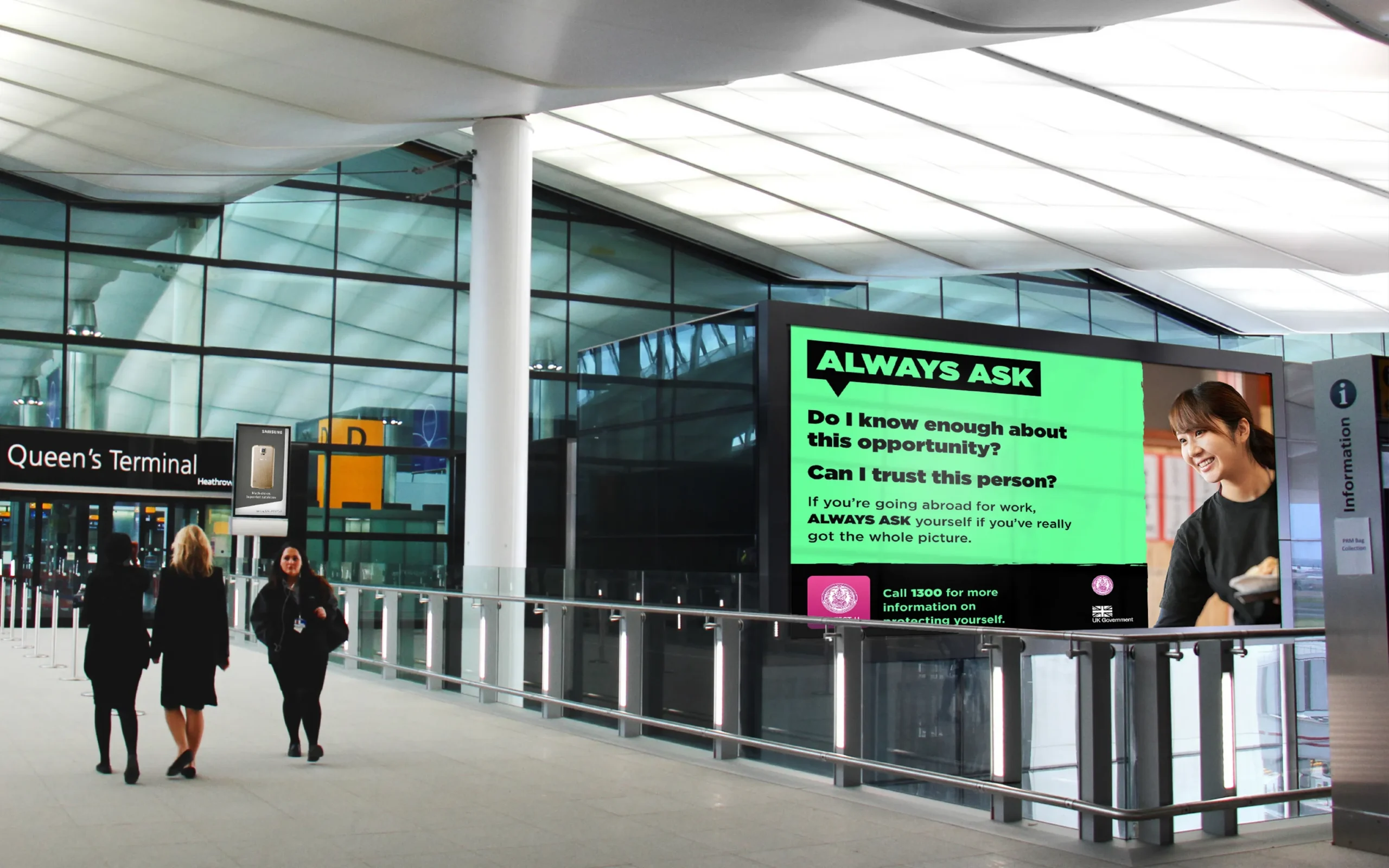 Image of campaign design displayed on digital screen in a public transport building.